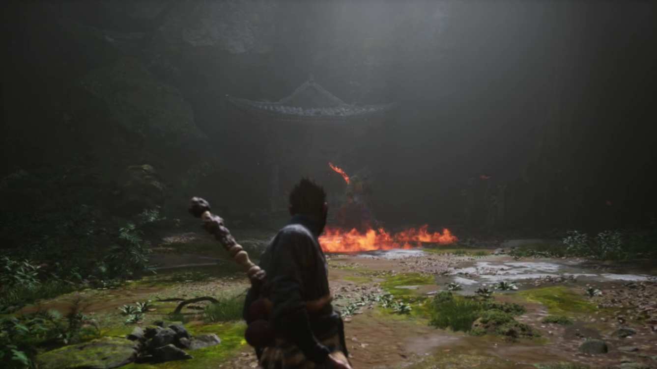 Encountering Guangzhi in Black Myth Wukong, forest clearing, Monkey wields a staff while Guangzhi wields a flaming staff.